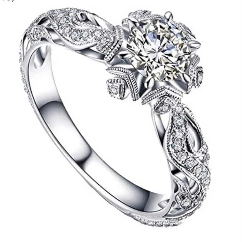 Sterling silver, .5 ct. CZ star engagement ring. Size 10.